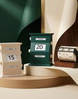 Vintage Perpetual Desk Calendars in cream, green and wheel styles against a green wall