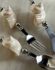 Shoreline Cutlery Set: spoon, fork and butter knife with natural shell handles on marble