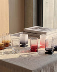 Sculpted Pedestal Glasses in mixed colours on a windowsill