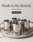 Set of four Double-Wall Glossy Stainless Steel Cups on a round tray, made to be shared