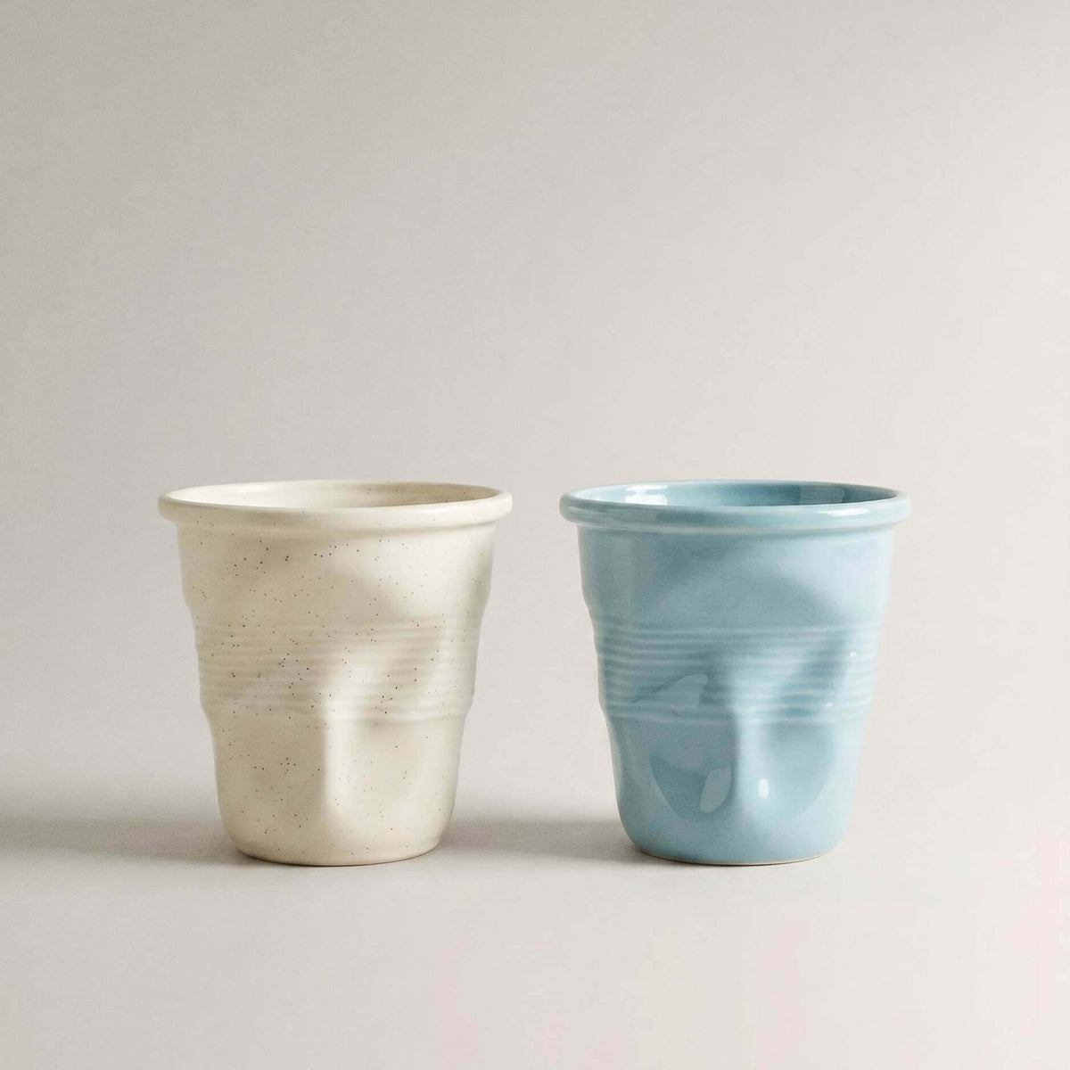 Beige and blue Crushed Ceramic Mugs side by side