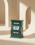 Green block Vintage Perpetual Desk Calendar on a curved shelf