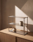 Aira stainless steel shelf with clean Bauhaus lines displaying objects by LoveÉcru