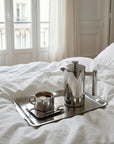 Morning Coffee Set rectangular tray with Venice cup and French press on a bed
