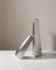 Arco Stainless Steel Vases, small and large, leaning together