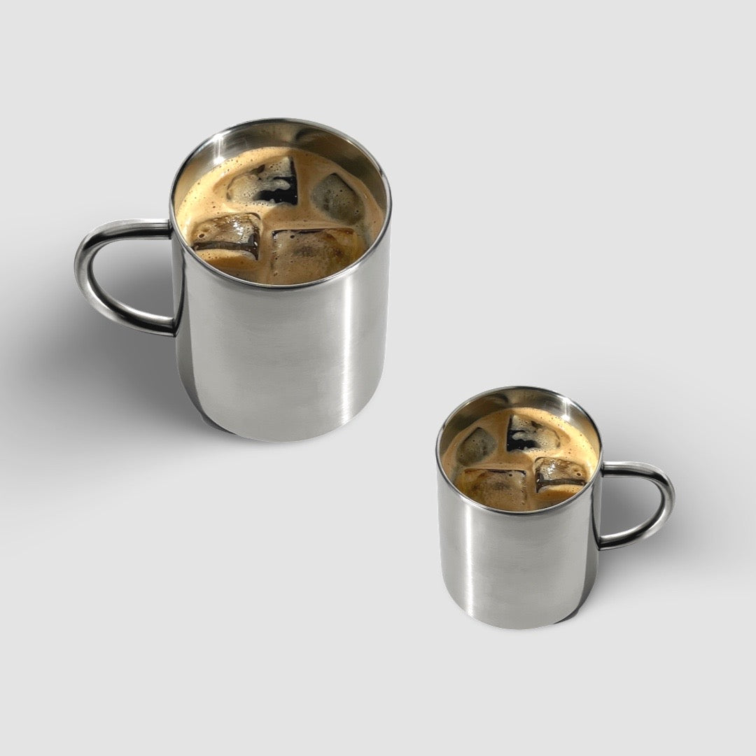 Milano Duo Set stainless steel double-walled cups with coffee, showcasing modern elegance and functionality.