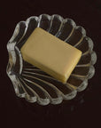 Clara Glass Shell Dish holding a block of butter