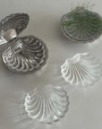 Two Clara Glass Shell Dishes with metal shell boxes and a sprig of dill