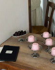 Elegant Dessert Cups filled with pink panna cotta on a wooden table