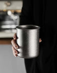 Tetsu Cup held in a hand, showing its size