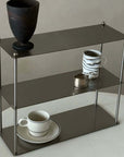 "Aira Stainless Shelf displaying cups and decorative vase, modern minimalist design, brushed 304 stainless steel finish"