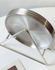 Set of Six Stainless Steel Plates in the wire stand, side view
