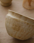 Hand-glazed matcha bowl in Warm Sand showing the glaze texture