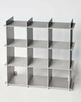 Stello Countertop Grid Shelf 4×4 in raw aluminum, empty, angled view