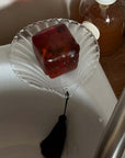 Lumière Shell Glass Dish holding a bar of amber soap on a bathroom sink