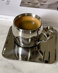 Tazza di caffè espresso in acciaio stile italiano con piattino e cucchiaio