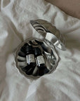 Vintage Metal Shell Box open, holding small perfume bottles