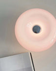Pink Halo Touch Lamp lit, glowing from above