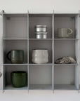Stello Countertop Grid Shelf 3×3 filled with ceramic cups and bowls