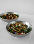 Two Kyoto Stainless Steel Bowls with salad, one large and one small