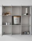 Stello Countertop Grid Shelf 4×4 mounted on a wall with candles and jars