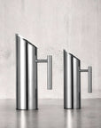 Stainless Steel Water Carafes in two sizes against a grey wall