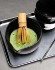 Minimalism Stainless Steel Serving Tray with a black matcha bowl, bamboo whisk and scoop