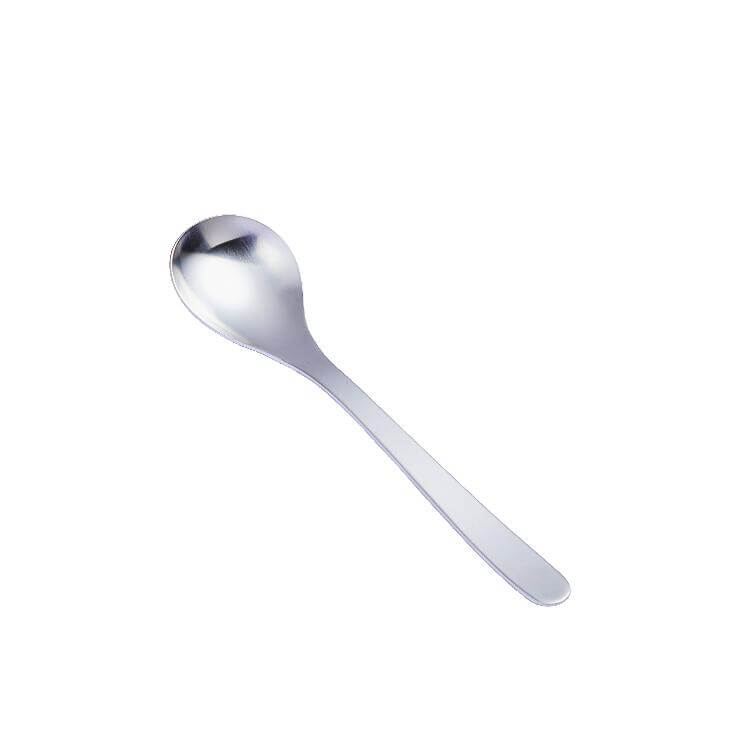 Stainless steel spoon on white background, perfect for dining and kitchen use.