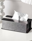 Steelform Tissue Box with tissues on a white table beside a ceramic vase