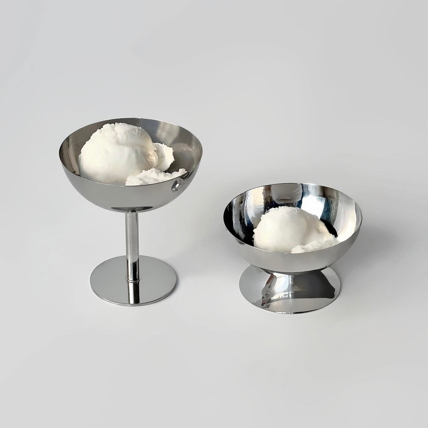 Stylish stainless steel ice cream bowls showcasing a refined dessert experience with creamy scoop.