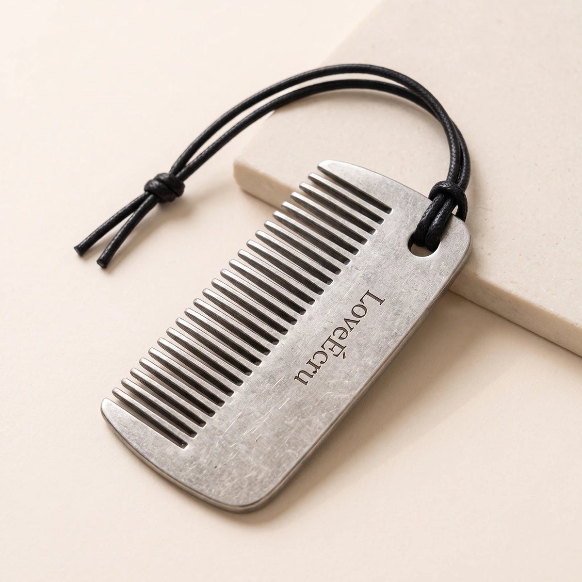 LoveÉcru stainless steel comb with black cord loop
