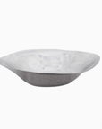 Sculpted steel bowl showcasing modern minimalism, with gentle curves and a mirror-polished surface for artistic elegance.