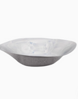Sculpted steel bowl showcasing modern minimalism, with gentle curves and a mirror-polished surface for artistic elegance.