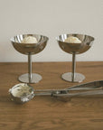 Two tall Minimalism Stainless Steel Ice Cream Cups on a wooden table with an ice cream scoop