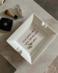 Wild Hearts ceramic tray on a marble table with a lipstick and perfume