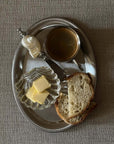 Shoreline Cutlery with the Clara shell dish and butter on a breakfast tray