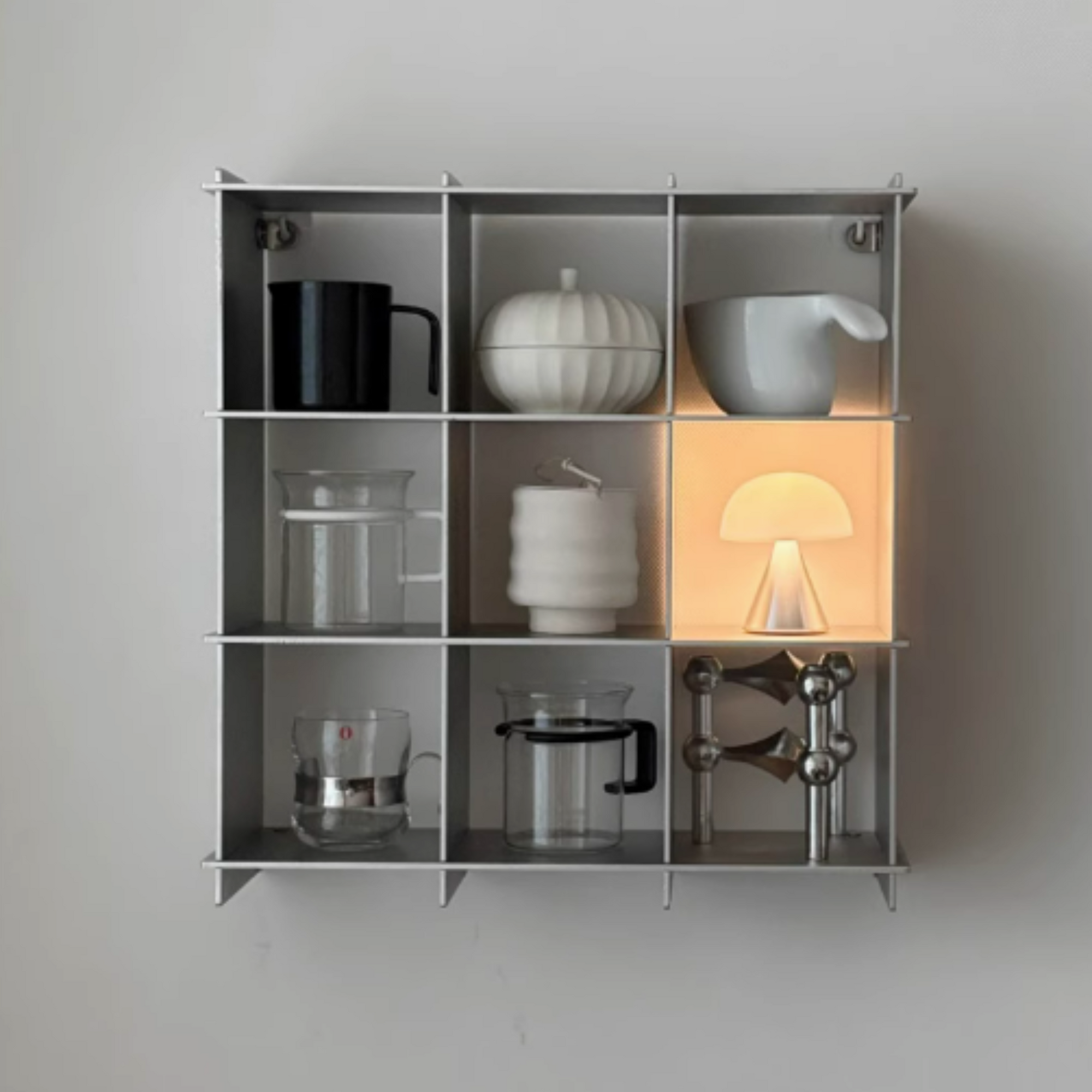 Stello Countertop Grid Shelf displaying mugs and decor in a modern brushed stainless steel design.