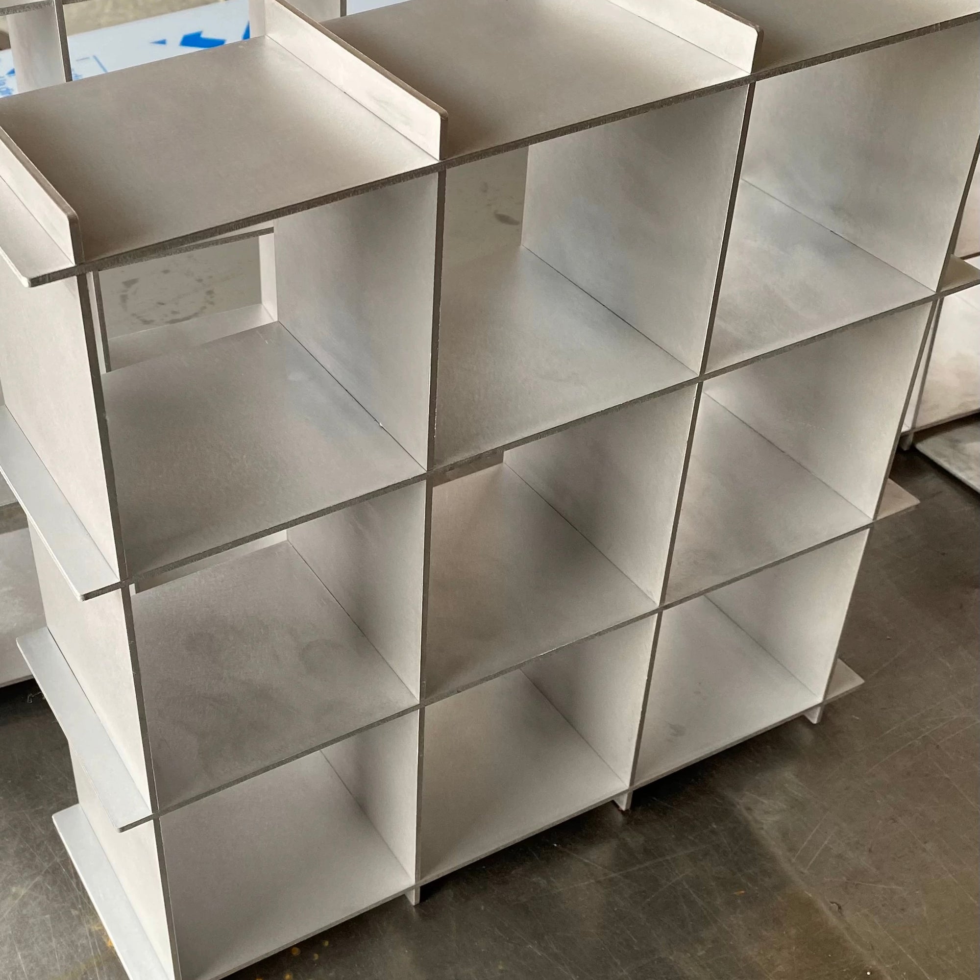 Stello Countertop Grid Shelf featuring nine open cubbies in brushed stainless steel, ideal for stylish organization.