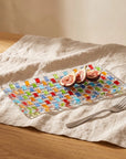 Tessera rectangular platter with halved figs and a fork on a linen tablecloth