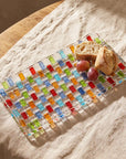 Tessera rectangular platter with bread and grapes on linen, seen from above