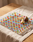 Tessera square platter with pear wedges and a fig on a linen tablecloth