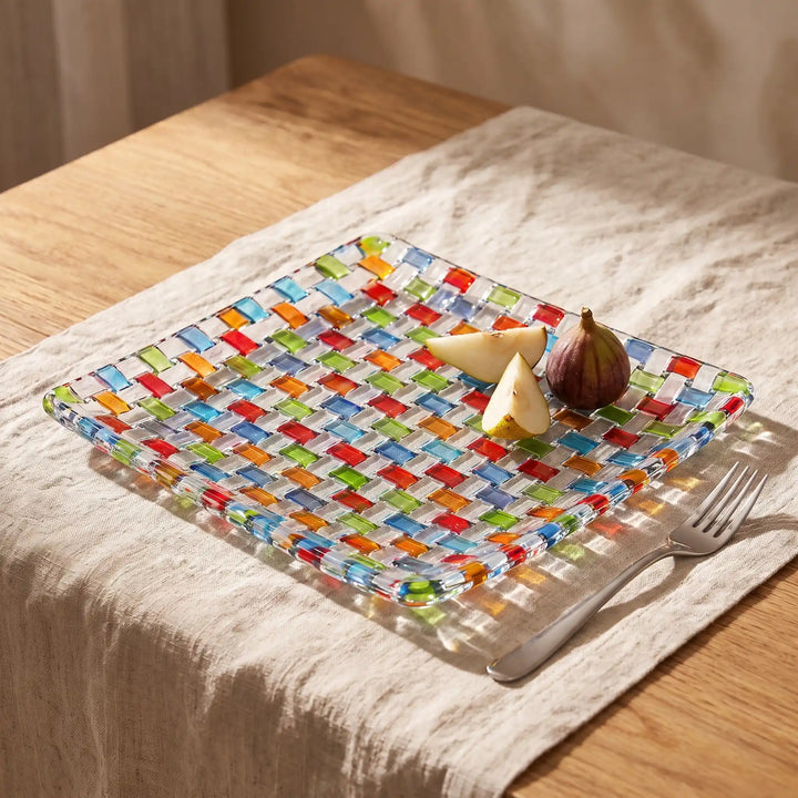 Tessera square platter with pear wedges and a fig on a linen tablecloth
