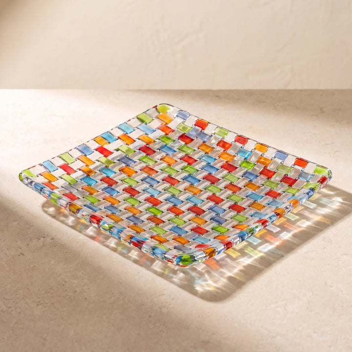 Tessera square platter on a sunlit stone surface, throwing colour onto the stone