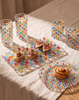 Tessera Table set, rectangular: rectangular platter with canapés and figs, 23.5 cm plate with a pastry and four mosaic glasses on linen