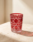 Red Vetra Lattice glass in sunlight on a stone table