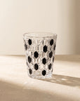 Black Vetra Raindrop glass in sunlight on a stone table