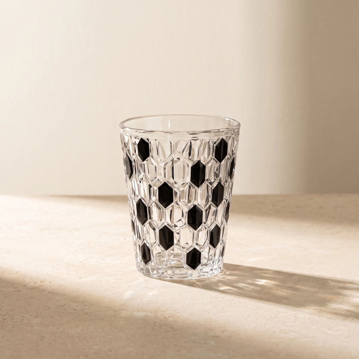 Black Vetra Raindrop glass in sunlight on a stone table