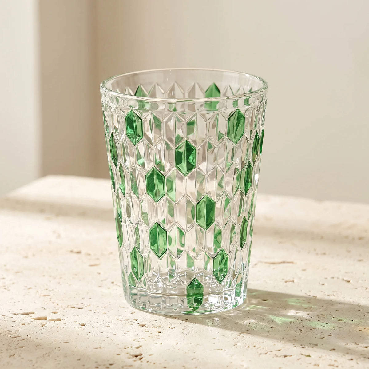 Green Vetra Raindrop glass in sunlight on a stone table
