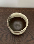 Top view of a ceramic Wabi-Sabi Matcha Bowl with rustic design, perfect for Japanese tea ceremonies.