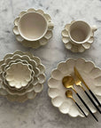 Elegant Rinka Bundle 2 tableware with flower petal design, showcasing Japanese craftsmanship by designer Kaneko Kohyo.